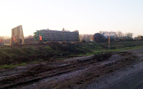 A view of the train accident and derailment at dawn on March 19, 2013 in North Zulch, TX following a collision with a chicken truck the night before on March 18, 2013. and Photo credit: KBTX.com